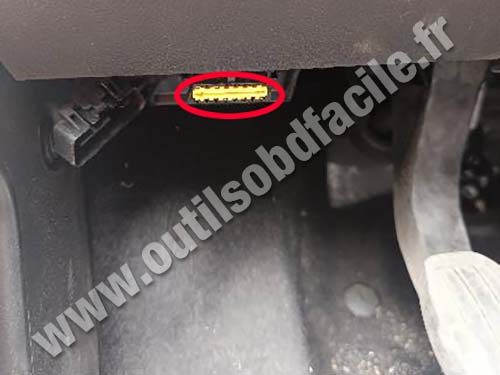 View of OBD socket above footrest